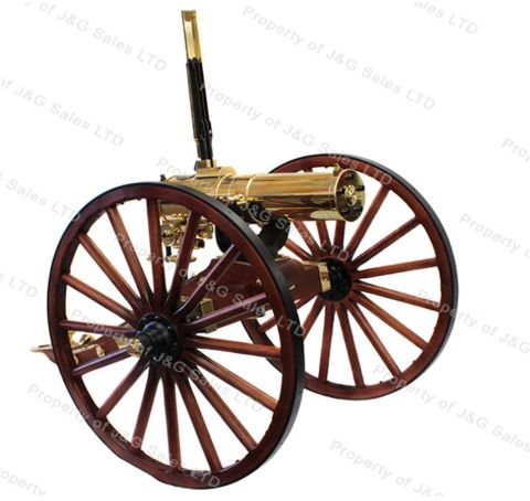 1972 Ford Ranchero - This brass gatling gun features wooden spoked wheels and a prominent brass barrel.