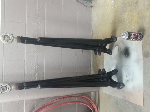 1996 Ford Bronco - Control arms recently painted black, with a can of spray paint nearby.