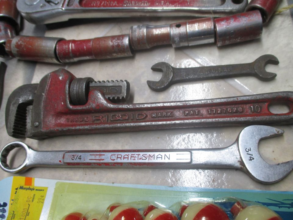 Pipe wrench, Craftsman wrench, and other assorted tools