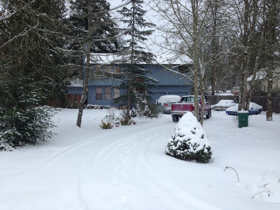 1992 Ford F-150 pickup truck parked in a snowy driveway with other vehicles