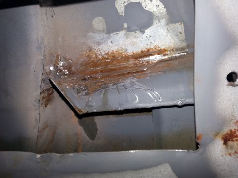 1992 Ford Bronco - cleaning up the inside..not sure if I'm going to have to weld up the corner yet or not. there are a number of holes in there from where the…