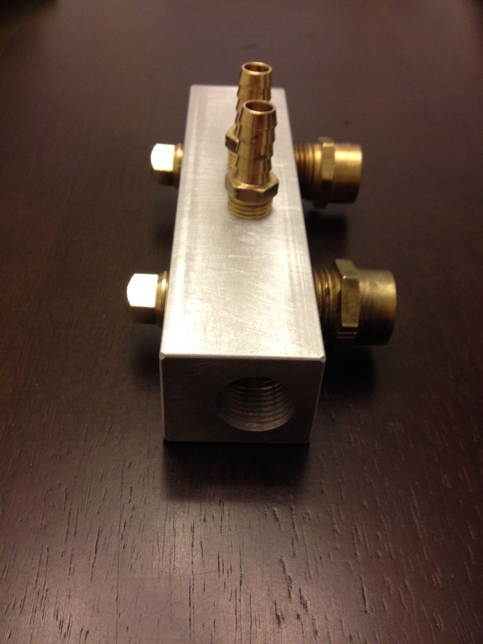 I put 3/8 NPT tapped holes opposite the 1/2 NPT holes for the fan switches in case I ever need to use different temperature fan switches. 3/8 inch switches are more common.