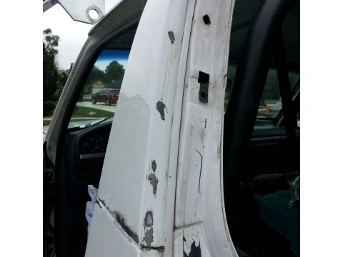 1992 Ford Bronco - these gray blobs are the remnants of the holes from my old soft top bracket. will smooth them down then cover over with filler and seam sea…