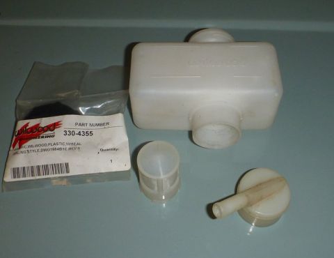 1969 MINI Cooper - A white plastic brake fluid reservoir and its cap are shown next to a labeled part from Wilwood Engineering.