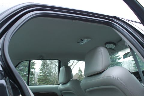2005 Ford Crown Victoria - Interior view of a 2005 Ford Crown Victoria, highlighting the headliner and seating.