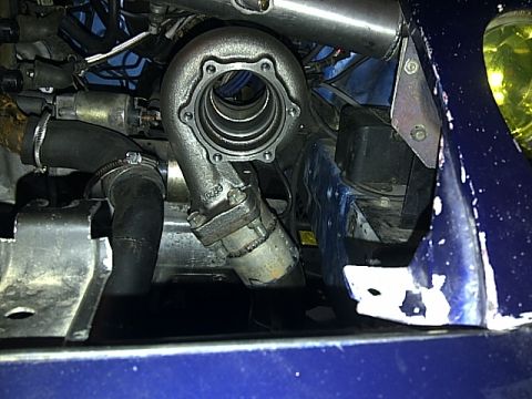 1995 Ford Probe - This image shows a turbocharger and associated engine components, not a 1995 Ford Probe.