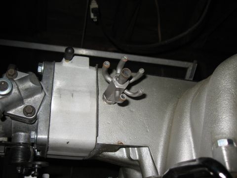 1994 Ford Bronco - A detailed view of an engine's intake manifold, showing its complex structure and vacuum lines.