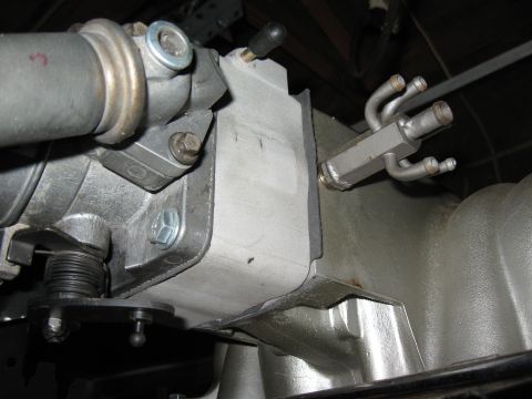 1994 Ford Bronco - Detail of engine components, including the intake manifold and throttle body, with visible fuel lines.