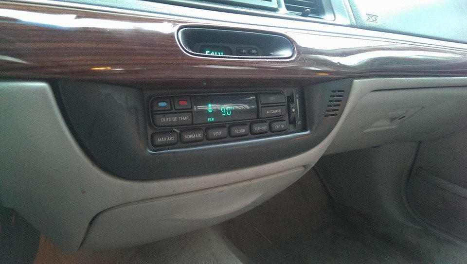 2000 Mercury Grand Marquis interior climate controls with digital display showing 90 degrees