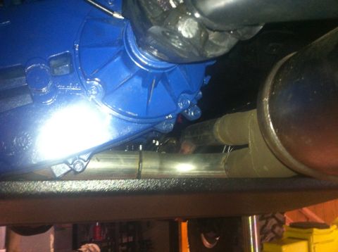 1982 Ford Bronco - Close-up view of the undercarriage, showing a freshly painted blue transmission and exhaust system.