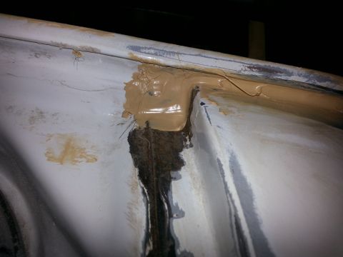 1992 Ford Bronco - underneath the rain gutter.