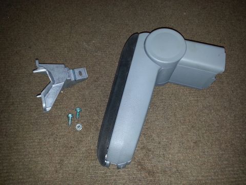 2002 Volkswagen Jetta - Armrest and bracket for a Volkswagen Jetta, with mounting hardware shown.