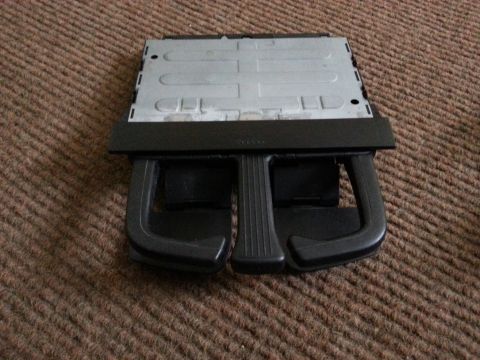 2002 Volkswagen Jetta - This is a car cup holder assembly, likely from an older model vehicle.