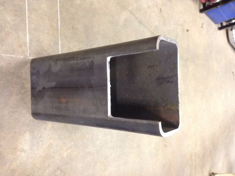 1993 Ford Bronco - A metal C-channel part is shown on a concrete floor, with the Supermotors.net logo in the lower right corner.