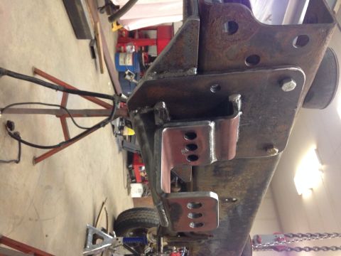 1993 Ford Bronco - Custom brackets are welded onto the vehicle's frame, likely for suspension modification.
