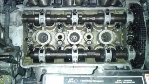 1993 Ford Taurus - Close-up of an engine's internal components, including camshafts and a timing chain.