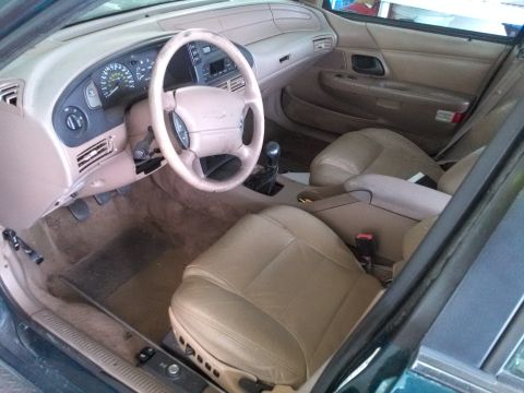 1993 Ford Taurus - Interior view of a 1993 Ford Taurus, tan leather seats and dashboard.