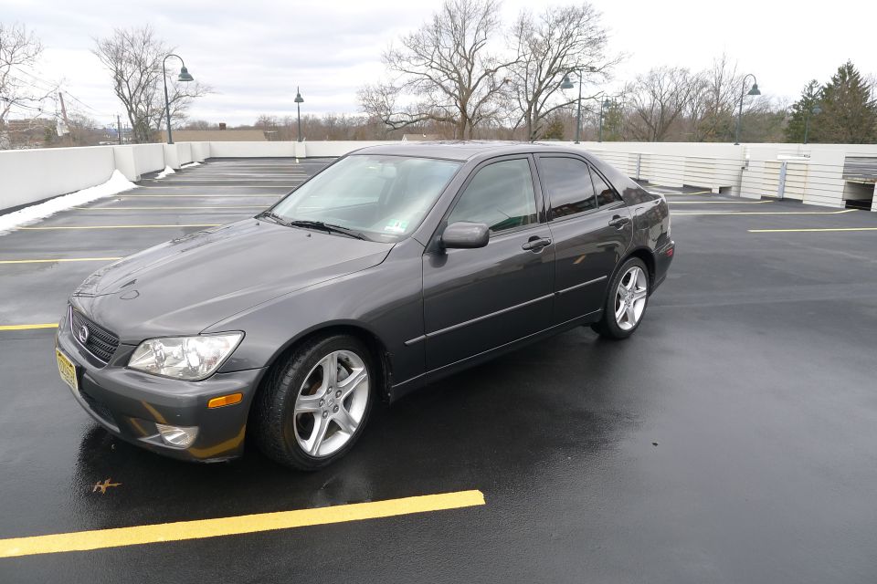 2002 Lexus IS 300 sedan, dark gray, parked in an outdoor lot