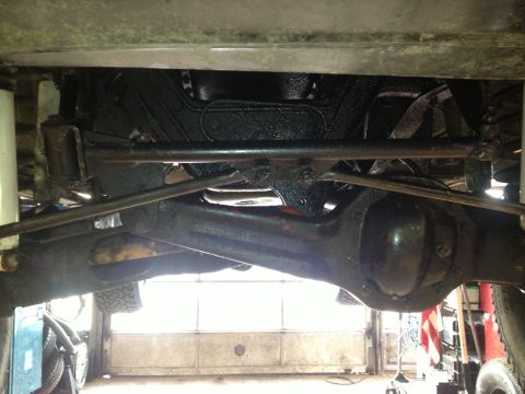 1995 Ford Bronco - Close-up of the undercarriage, showing suspension components and the rear differential.