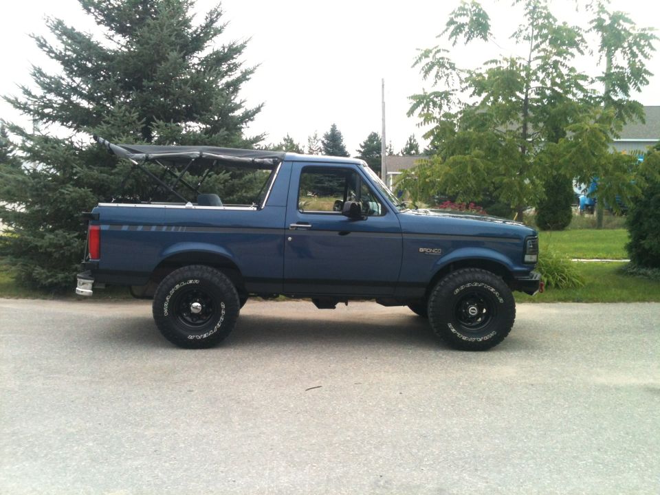 1996 Ford Bronco with soft top, side view