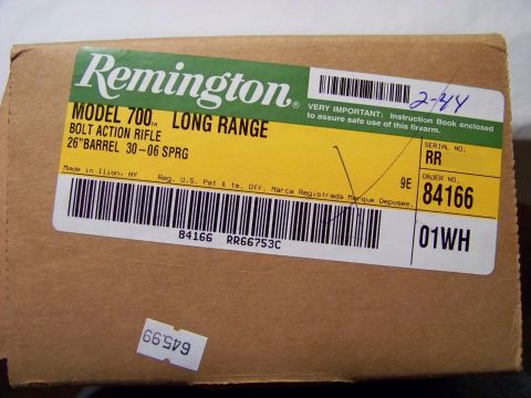 1995 Mercury Grand Marquis - A label on a box details a Remington Model 700 Long Range bolt action rifle, made in Ilion, NY.