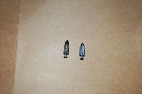 2006 Honda RANCHER - Two carburetor float needles are shown against a plain background.