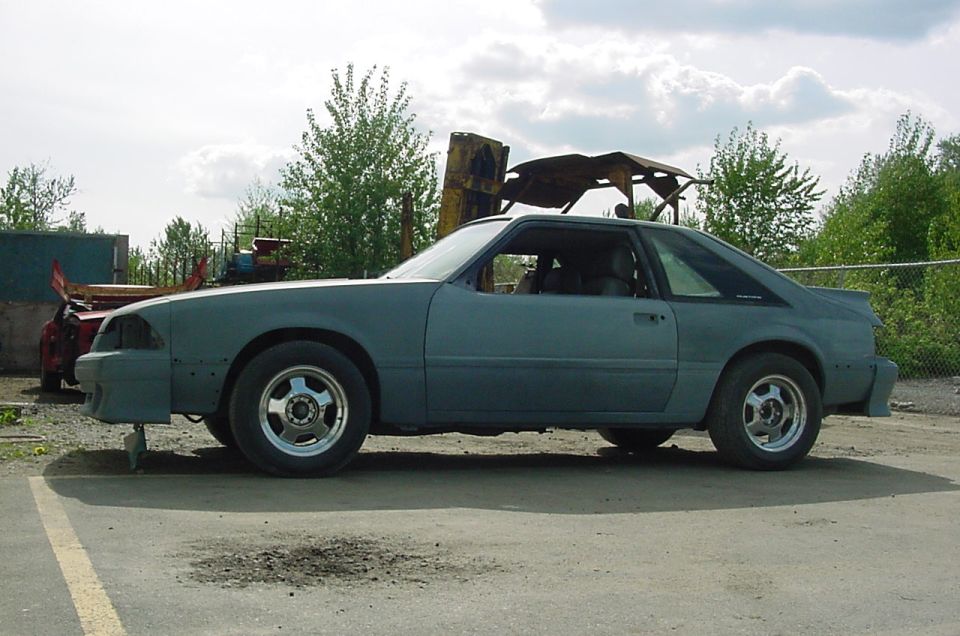 Gray coupe, side view, unfinished bodywork