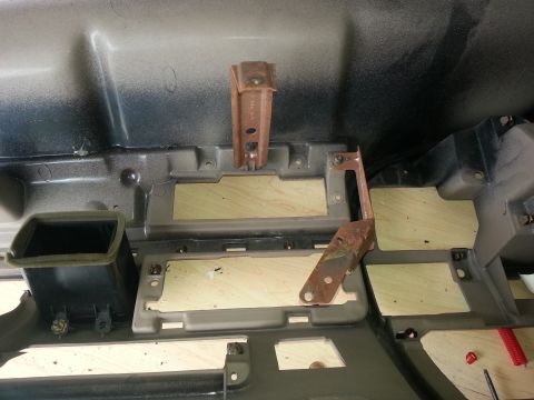 1994 Ford Bronco - Interior dashboard components with air vent and mounting hardware visible.