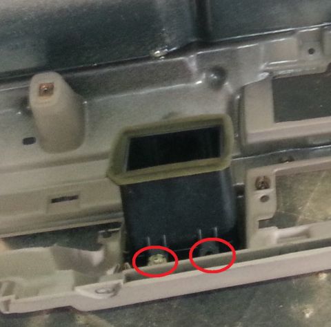 1994 Ford Bronco - This photo shows a close-up view of a vehicle's dashboard, focusing on an air vent and mounting hardware.