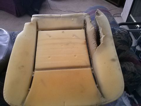 1996 Ford Bronco - Exposed car seat foam and wooden frame, likely for repair or replacement.