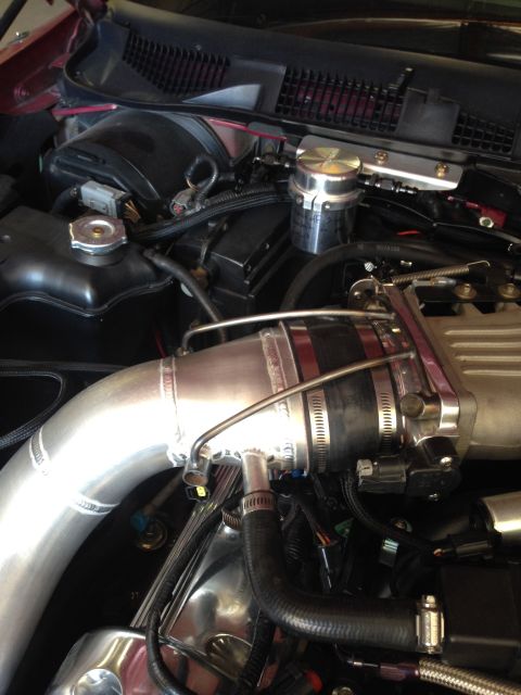 1992 Ford Crown Victoria - Aftermarket intake system installed in an engine bay with custom modifications visible.