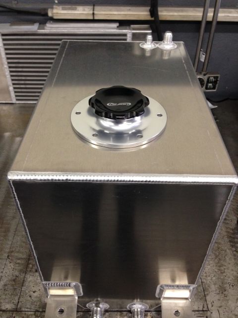 1992 Ford Crown Victoria - An aluminum fuel tank with a black cap and fittings is shown from a top-down perspective.