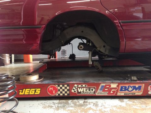 1992 Ford Crown Victoria - The rear suspension of a 1992 Ford Crown Victoria is shown while on a lift for service.