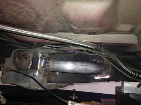 1992 Ford Crown Victoria - Custom exhaust modification visible on the underside of a vehicle.