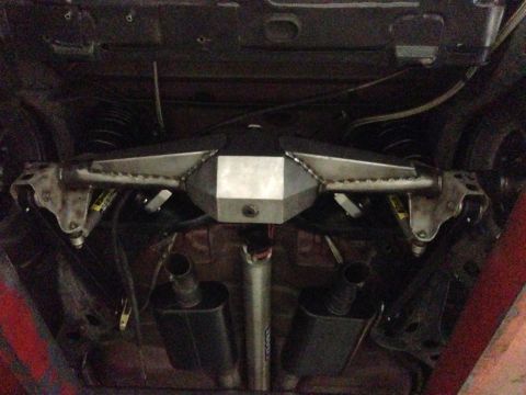 1992 Ford Crown Victoria - Underside view of a custom rear axle assembly and dual exhaust system on a vehicle.