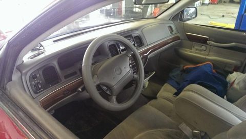 2000 Mercury Grand Marquis - The interior of a 2000 Mercury Grand Marquis is visible, with a focus on the dashboard and seating area.