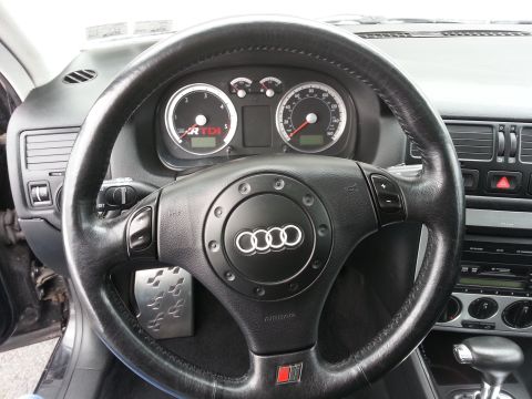 2002 Volkswagen Jetta - Interior view of a car's dashboard and steering wheel, showing gauges and controls.