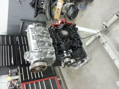 2002 Volkswagen Jetta - An engine is mounted on a stand, ready for installation or repair.