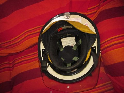 1991 Ford Crown Victoria - The inside of a helmet is shown, revealing its lining, straps, and a clear visor.