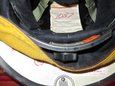 1991 Ford Crown Victoria - Helmet interior with padding and a manufacturing date label visible.