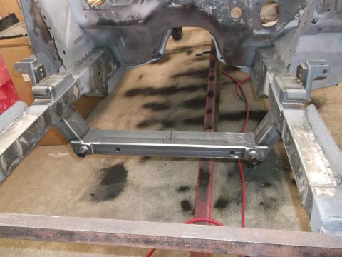 1967 Ford Mustang - Custom crossmember installed on a car frame during restoration.