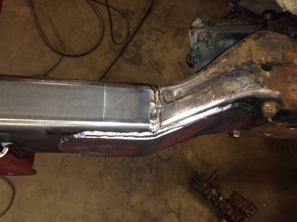 welded frame section with some rust and bolts