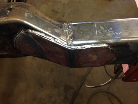 1993 Ford Bronco - A close-up view of a welded metal frame section, possibly a vehicle chassis component, with visible repair work.