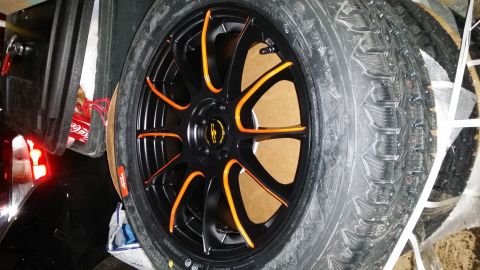 2014 Subaru Outback - Aftermarket wheel and tire assembly, likely for winter use.
