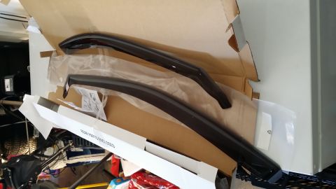 2014 Subaru Outback - The photo shows a pair of aftermarket window visors, not a 2014 Subaru Outback.