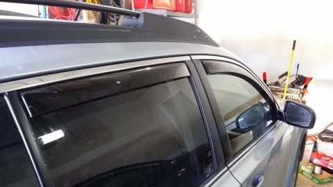 2014 Subaru Outback - Side view of a 2014 Subaru Outback showing the installed window visors.