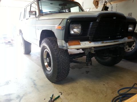 1982 Jeep Wagoneer - Front view of a 1982 Jeep Wagoneer, showing its distinctive grille and aftermarket wheels.