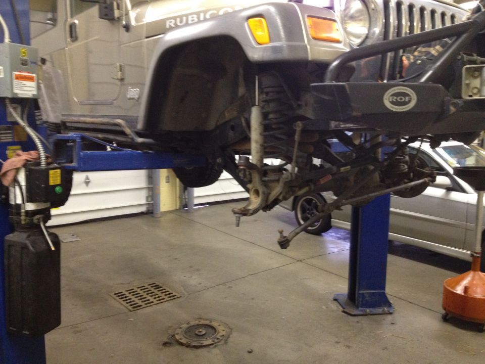 Jeep Wrangler front suspension on lift, 'Rubicon' visible