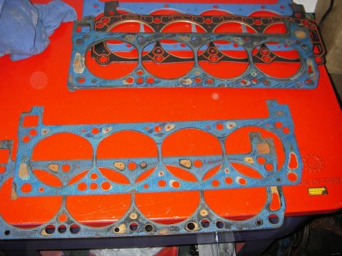1972 Ford Ranchero - Engine gaskets are laid out on an orange surface, possibly for a vehicle repair or restoration project.