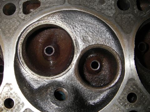 1972 Ford Ranchero - Close-up view of an engine cylinder head showing two valve openings, one significantly larger than the other. Text from Supermotors.net is…